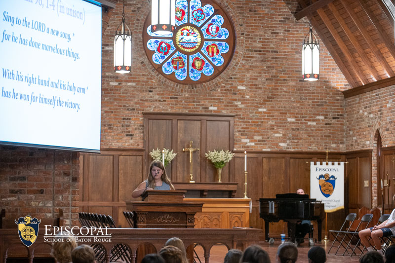 Middle School student reading in Chapel