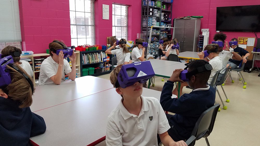 Sixth graders explore volcanoes with the help of virtual reality viewers.