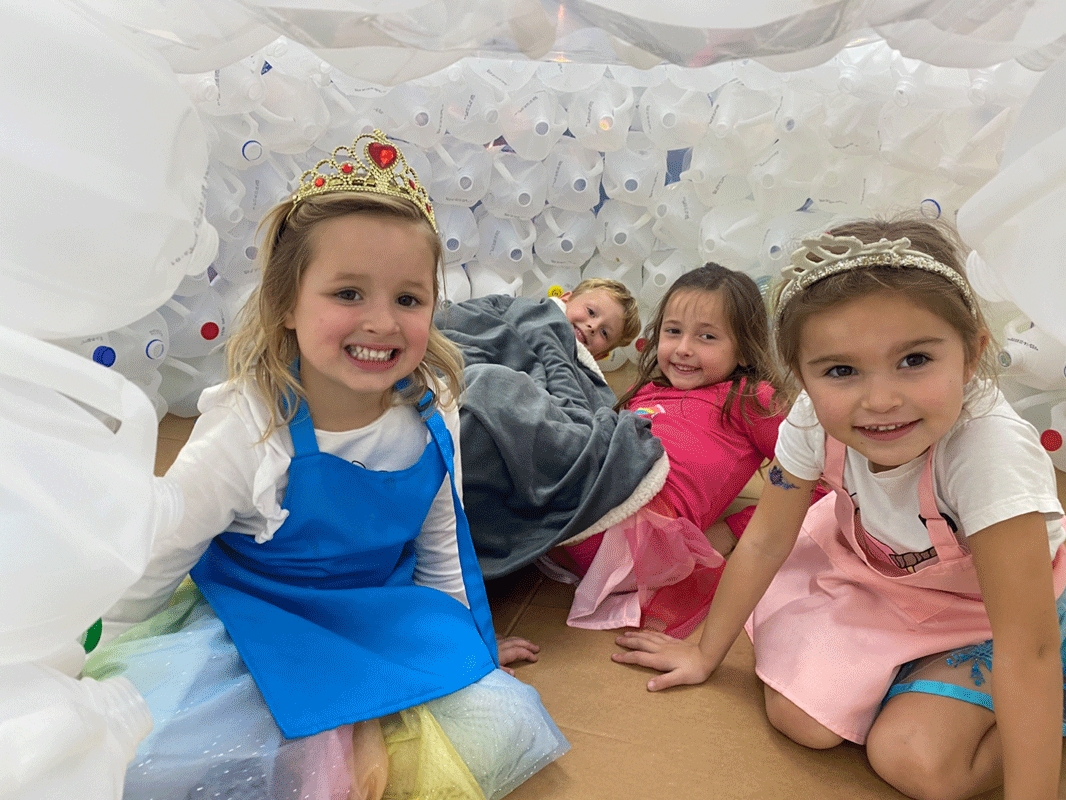 PreK reading in the QUEST Center igloo.