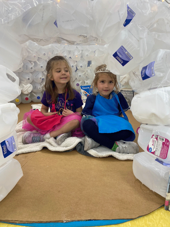 PreK reading in the QUEST Center igloo.