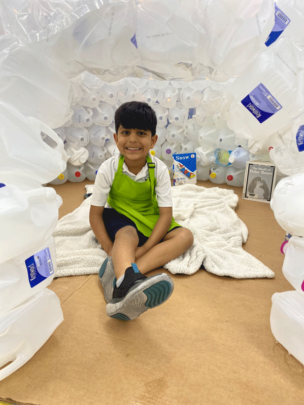 PreK reading in the QUEST Center igloo.