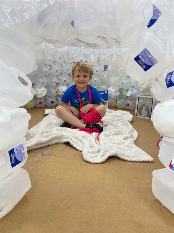 PreK reading in the QUEST Center igloo.