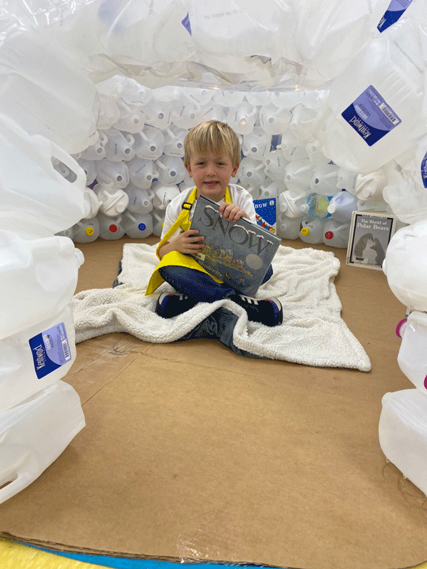 PreK reading in the QUEST Center igloo.