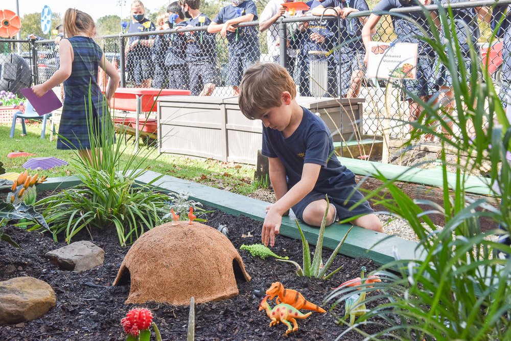 Child playing in the garden