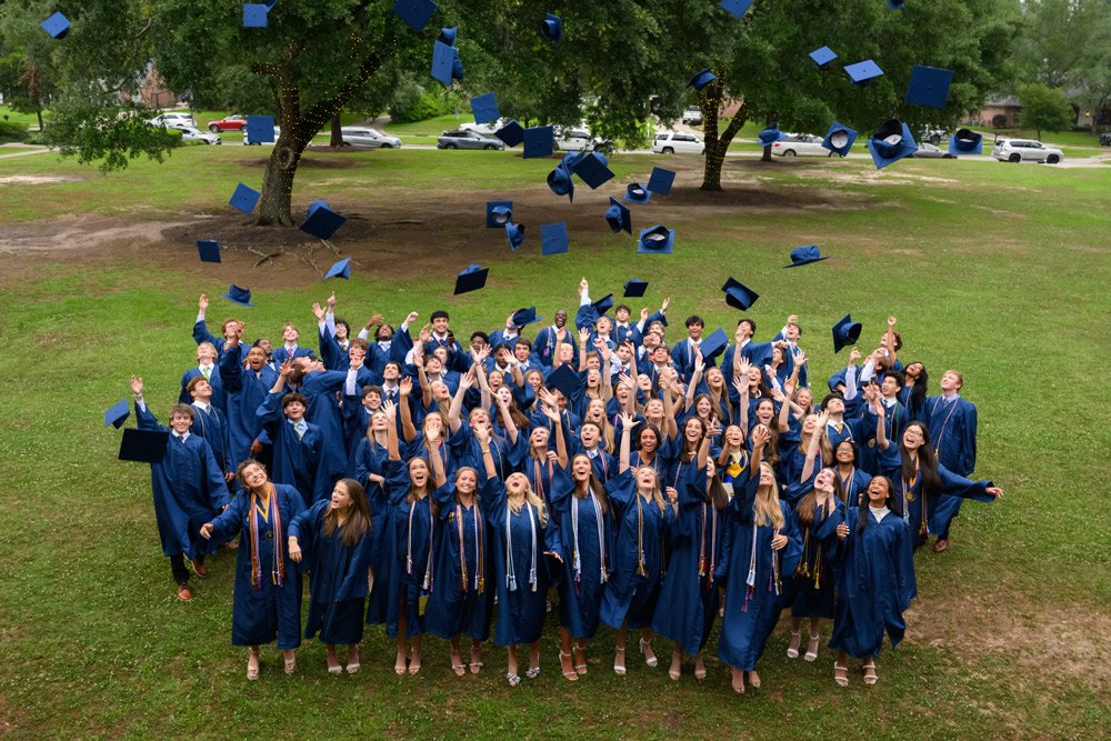 Students Graduating with Caps and Gowns