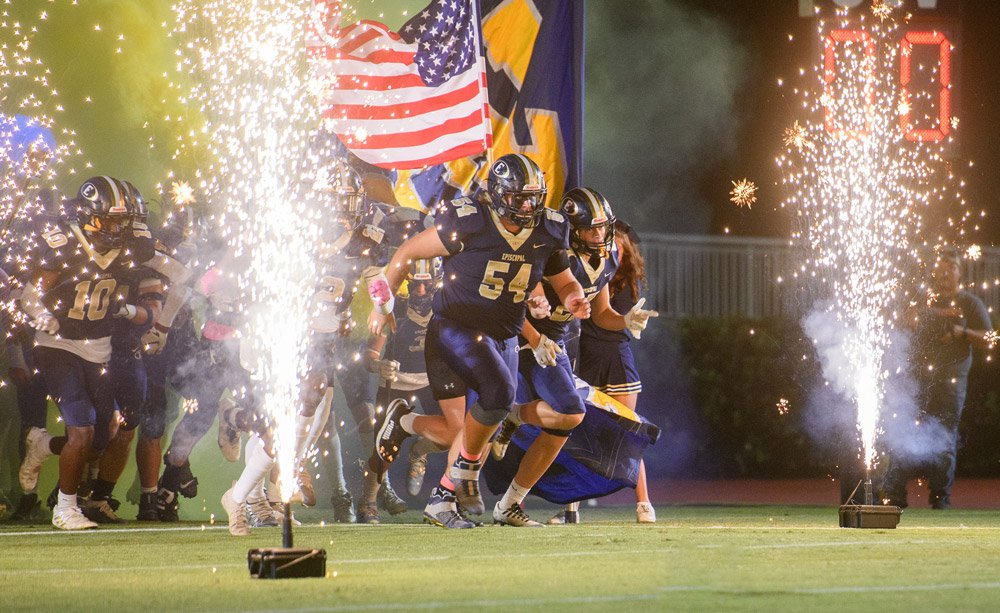 Football team entering the field