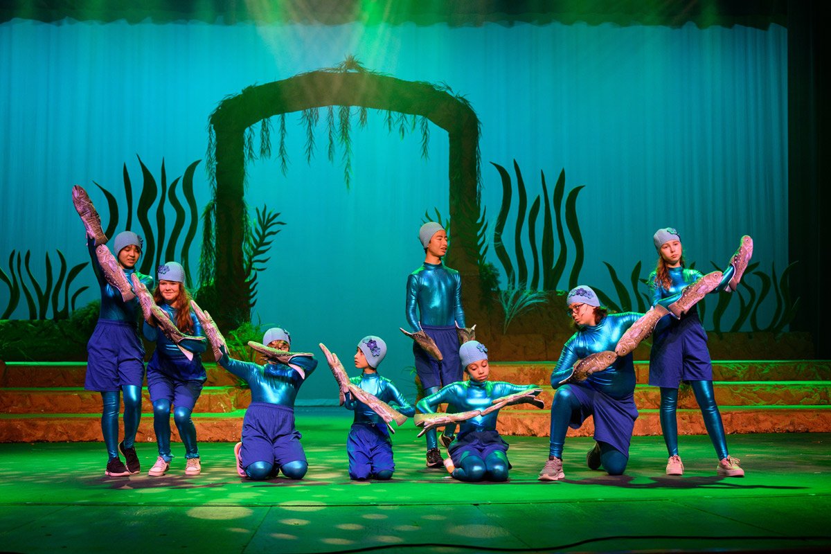 Students perfoming on stage