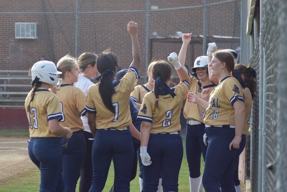 Softball team celebrating a win