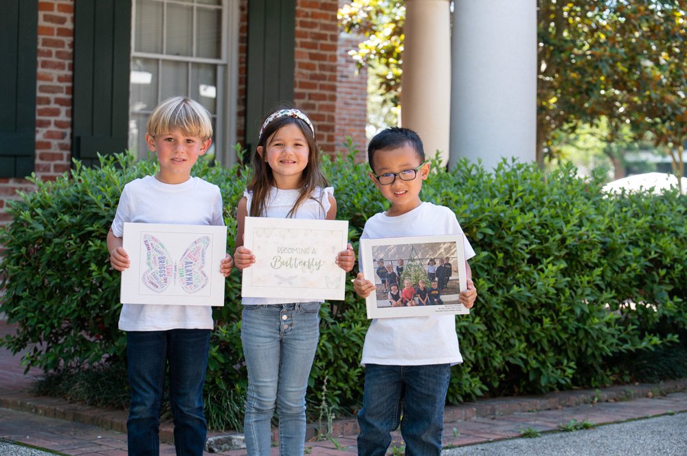 PreK-4 students with butterfly books