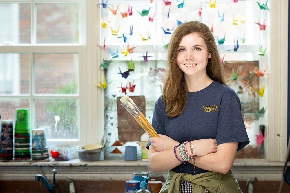 Art student with paint brushes