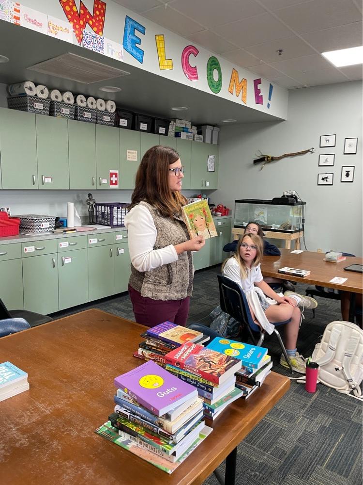 Teacher showcasing books