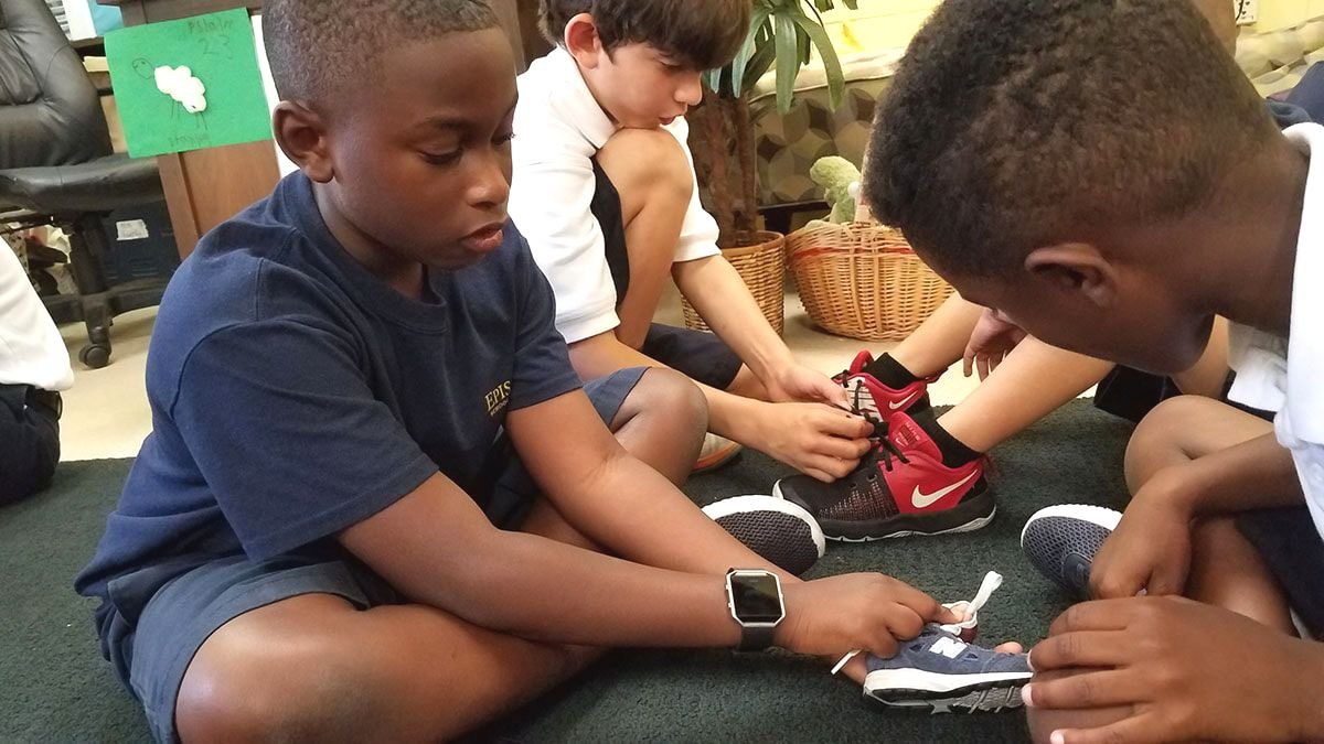 Students tying their shoe