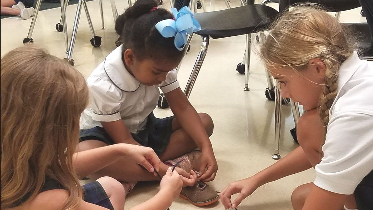 Students tying their shoes