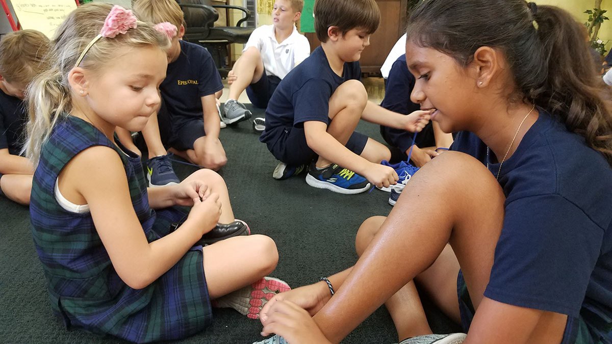 Students tying their shoes