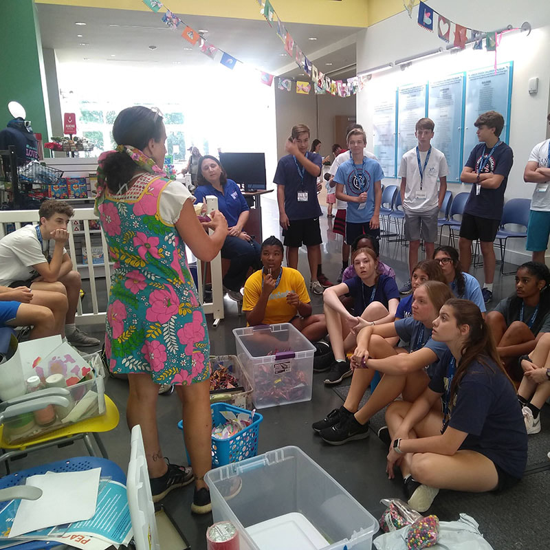 Students listen to project directions.