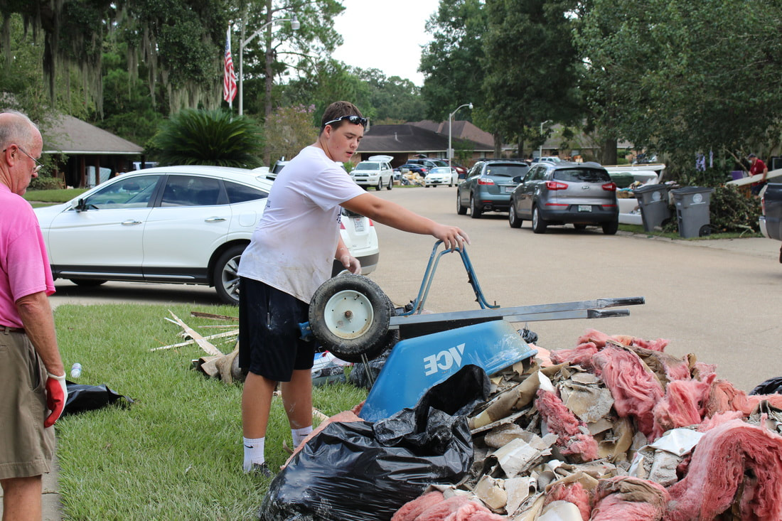 Students help after flood.